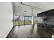 Bright living room with hardwood floors, a modern fireplace, and floor-to-ceiling windows showcasing city views at 3111 Bel Air Dr # 27E, Las Vegas, NV 89109