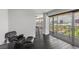 Bright living room with a comfortable chair and ottoman, featuring large windows with expansive city views at 3111 Bel Air Dr # 27E, Las Vegas, NV 89109