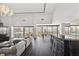 Bright living room featuring dark wood floors, modern furniture, and city views from floor-to-ceiling windows at 3111 Bel Air Dr # 27E, Las Vegas, NV 89109