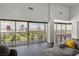 Bright living room featuring hardwood floors, floor to ceiling windows and stunning views of the Las Vegas skyline at 3111 Bel Air Dr # 27E, Las Vegas, NV 89109