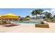 Beautiful community pool with seating and a view of the city at 3111 Bel Air Dr # 27E, Las Vegas, NV 89109