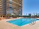 Beautiful community pool with seating and plenty of space for residents at 3111 Bel Air Dr # 27E, Las Vegas, NV 89109