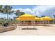 Beautiful community pool with seating and tables for relaxing at 3111 Bel Air Dr # 27E, Las Vegas, NV 89109