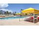 Beautiful community pool with seating and a view of the city at 3111 Bel Air Dr # 27E, Las Vegas, NV 89109