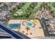 Aerial view of the pool and tennis court within a community of homes at 3111 Bel Air Dr # 27E, Las Vegas, NV 89109