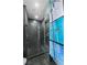 Modern bathroom featuring a glass enclosed shower with dark tile at 3111 Bel Air Dr # 27E, Las Vegas, NV 89109