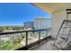 Balcony view showcasing a luxury hotel, palm trees, and mountain views, creating a serene escape at 322 Karen Ave # 601, Las Vegas, NV 89109