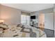 Bright bedroom with a desk, a balcony, and an ensuite bathroom, offering comfortable living space at 322 Karen Ave # 601, Las Vegas, NV 89109