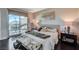 Relaxing main bedroom with balcony access and a cozy seating area at 322 Karen Ave # 601, Las Vegas, NV 89109