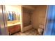Standard bathroom featuring a single sink, shower, and toilet at 3232 Dayflower St # 4, Las Vegas, NV 89121
