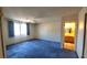 Bright, spacious bedroom with ample natural light, featuring a ceiling fan and plush carpeting at 3232 Dayflower St # 4, Las Vegas, NV 89121