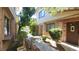Townhouse exterior with a welcoming walkway, lush greenery, and a warm, inviting ambiance at 3232 Dayflower St # 4, Las Vegas, NV 89121