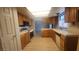 Functional kitchen boasts ample cabinet space, tile countertops, and modern appliances at 3232 Dayflower St # 4, Las Vegas, NV 89121