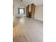 Bright living room with a brick fireplace, vaulted ceilings, and laminate wood flooring at 3232 Dayflower St # 4, Las Vegas, NV 89121