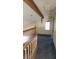 Loft area with exposed beam, window and carpeting at 3232 Dayflower St # 4, Las Vegas, NV 89121