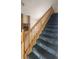 Carpeted staircase with wood railing leads to the upper level of the home at 3232 Dayflower St # 4, Las Vegas, NV 89121