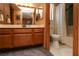 Bathroom features a wood vanity with storage and a well-lit mirror at 3236 Manzanita Ln, Laughlin, NV 89029