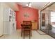 Inviting dining area with access to the backyard and charming white built-in at 3236 Manzanita Ln, Laughlin, NV 89029