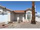 Charming single-story home features a tile roof, stucco exterior, and low-maintenance desert landscaping at 3236 Manzanita Ln, Laughlin, NV 89029