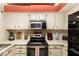 Well-equipped kitchen with modern appliances, ample storage, and bright lighting at 3236 Manzanita Ln, Laughlin, NV 89029