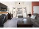 Bright and airy living room with a fireplace, large windows, and comfortable seating at 3236 Manzanita Ln, Laughlin, NV 89029