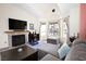 Inviting living room with a cozy fireplace, large windows, and comfortable seating arrangement at 3236 Manzanita Ln, Laughlin, NV 89029