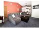 Spacious living room with a sectional sofa and seamless flow into the adjacent dining area at 3236 Manzanita Ln, Laughlin, NV 89029