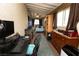 Comfortable living area featuring a desk, bed, dresser, and rustic decor, perfect for relaxation at 3236 Manzanita Ln, Laughlin, NV 89029