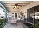 Charming covered patio with comfortable seating, plants, and a ceiling fan, creating an inviting outdoor space at 3236 Manzanita Ln, Laughlin, NV 89029
