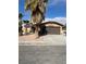 Charming single-story home with desert landscaping and a two-car garage at 3710 Royal Fern Cir, Las Vegas, NV 89115