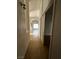 Hallway features a view to living room with tile flooring throughout at 3710 Royal Fern Cir, Las Vegas, NV 89115