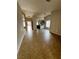 Open-concept room with tile flooring and view to kitchen at 3710 Royal Fern Cir, Las Vegas, NV 89115