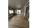 Open room with hardwood flooring and sliding glass doors leading to backyard at 3710 Royal Fern Cir, Las Vegas, NV 89115