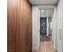 Contemporary hallway with wood floors leads to bathroom with glass enclosed shower at 3726 Las Vegas Blvd # 606, Las Vegas, NV 89158