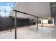 Covered back patio offers a shaded outdoor space, ideal for relaxing or entertaining near the yard at 4237 E Twain Ave, Las Vegas, NV 89121