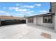 Spacious backyard featuring a concrete patio, secure fencing and access to the house at 4237 E Twain Ave, Las Vegas, NV 89121