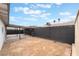 Large backyard features a covered patio area and a privacy fence, perfect for outdoor activities at 4237 E Twain Ave, Las Vegas, NV 89121