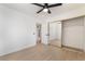 Bedroom featuring laminate flooring, ceiling fan, and mirrored closet doors at 4237 E Twain Ave, Las Vegas, NV 89121