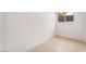 Bright bedroom featuring wood-look flooring and natural light from a window at 4237 E Twain Ave, Las Vegas, NV 89121