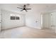 Minimalist bedroom with light hardwood floors, a ceiling fan and a window at 4237 E Twain Ave, Las Vegas, NV 89121