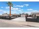 Stylish home featuring a gated driveway and secure fencing, offering a blend of security and curb appeal at 4237 E Twain Ave, Las Vegas, NV 89121