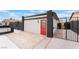 Detached garage featuring brick columns and a red door at 4237 E Twain Ave, Las Vegas, NV 89121