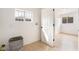 Cozy laundry room with a window and light wood-look flooring at 4237 E Twain Ave, Las Vegas, NV 89121