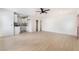 Spacious living room showcasing wood-look flooring, a ceiling fan, and an open layout at 4237 E Twain Ave, Las Vegas, NV 89121