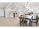 Open concept living and dining area featuring a bar with white cabinets at 4237 E Twain Ave, Las Vegas, NV 89121