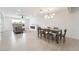 Spacious open-concept living and dining area with modern lighting and decor at 4237 E Twain Ave, Las Vegas, NV 89121