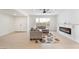 Bright living room features a comfortable couch, modern fireplace, and lots of light at 4237 E Twain Ave, Las Vegas, NV 89121