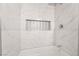 Marble tiled shower with a niche and rain shower head at 4237 E Twain Ave, Las Vegas, NV 89121