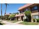 Exterior shot of townhomes with desert landscaping and a terra cotta tile roof at 4310 Lynnann Dr, Las Vegas, NV 89110