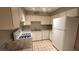 Bright kitchen with tile floors, white cabinetry, and modern appliances at 4310 Lynnann Dr, Las Vegas, NV 89110